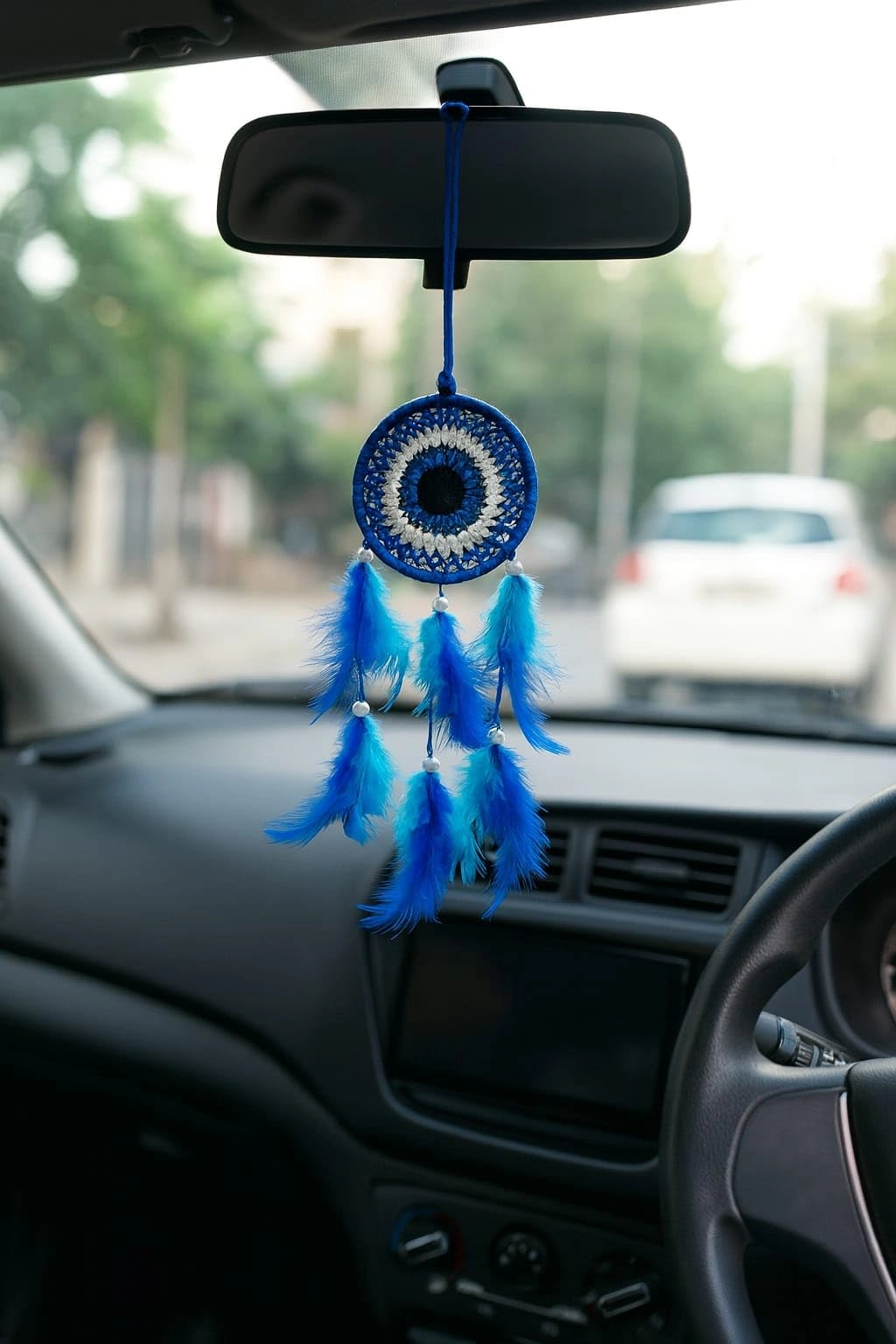 thincamaxe Evil Eye Dream Catcher - Beads (white pearl-style beads between feathers), Crochet Thread / Cotton Thread (used for the evil eye design), Feathers (blue & aqua blue decorative feathers), Hanging Cord / Nylon String (for attaching to car rear-view mirror)